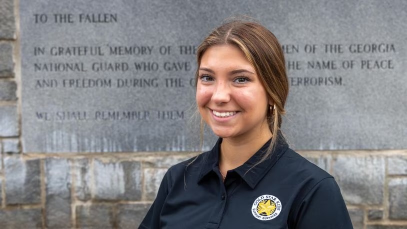 Teenager Leighanne Bryant poses for a head-and-shoulders picture. She is wearing a polo shirt with a Gold Star Kids Support Services logo.