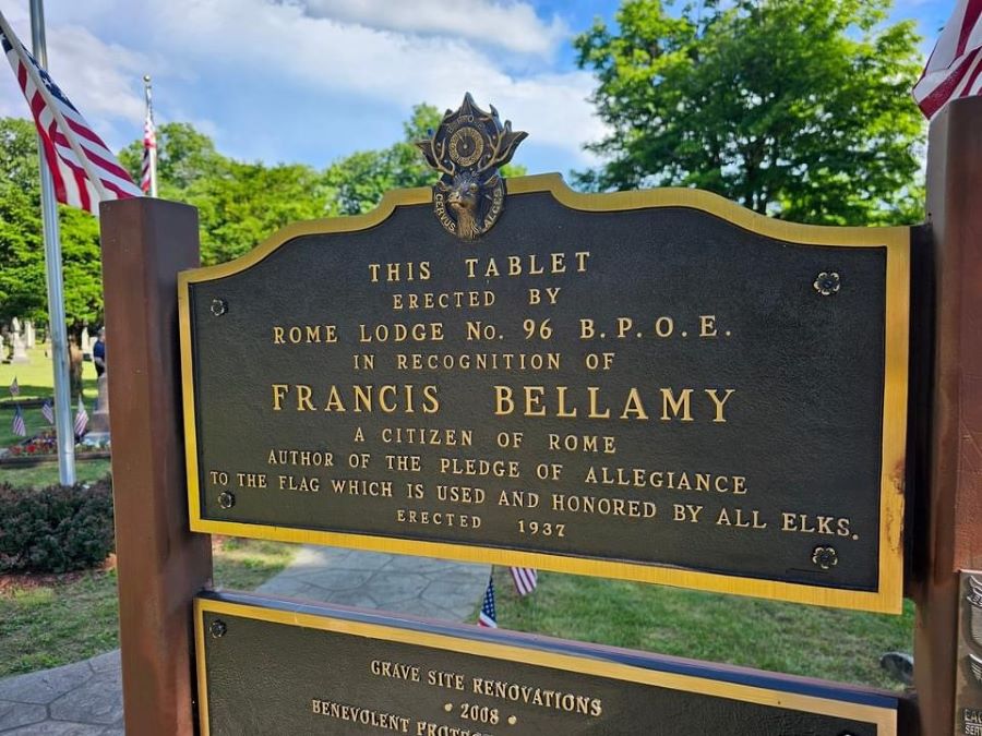 Photo is of a plaque that says "This tablet erected by Rome Lodge No. 96 B.P.O.E. in recognition of Francis Bellamy a citizen of Rome author of the Pledge of Allegiance to the flag which is used and honored by all Elks. Erected 1937."