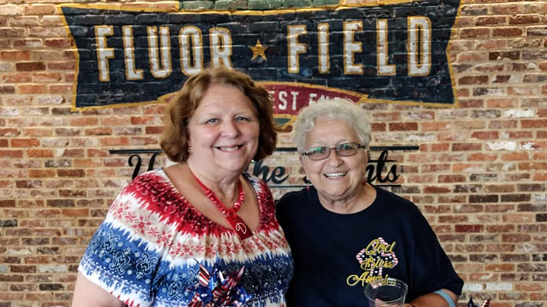 Two senior women are enjoying a nice day at Fluor Field in Greenville, South Carolina