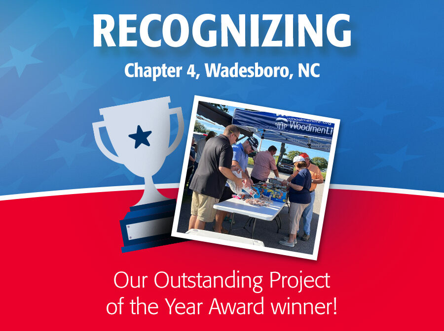 Image says "Recognizing Chapter 4, Wadesboro, NC, Our Outstanding Project of the Year Award winner!" There is also a picture of a group of people getting food at a tailgate under a WoodmenLife-branded tent. Alongside the photo is a graphic of a trophy. The background on the top half of the image is blue, and the bottom half is red.