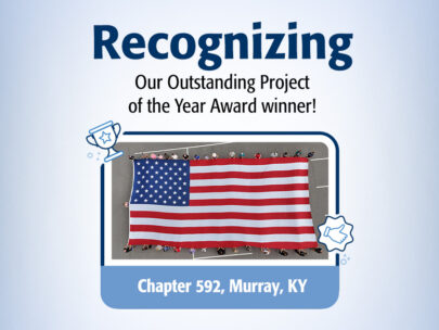 Graphic says "Recognizing Our Outstanding Project of the Year Award Winner! Chapter 592, Murray, KY." At the center of the graphic is an overhead photo of a Celebrating Red, White & Blue oversized flag display.