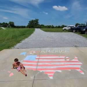 Boy with patriotic drawing of America