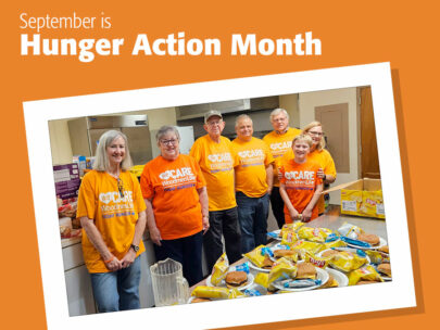 Image includes the words "September is Hunger Action Month." The background is orange, and it includes a snapshot of a group of seven people -- all wearing orange shirts that say "WeCare WoodmenLife Fight Hunger."