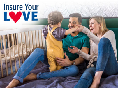 Stock image of a family. Mom and Dad are sitting on the floor while their toddler child is standing. The "Insure Your Love" logo is in the top left corner of the image.